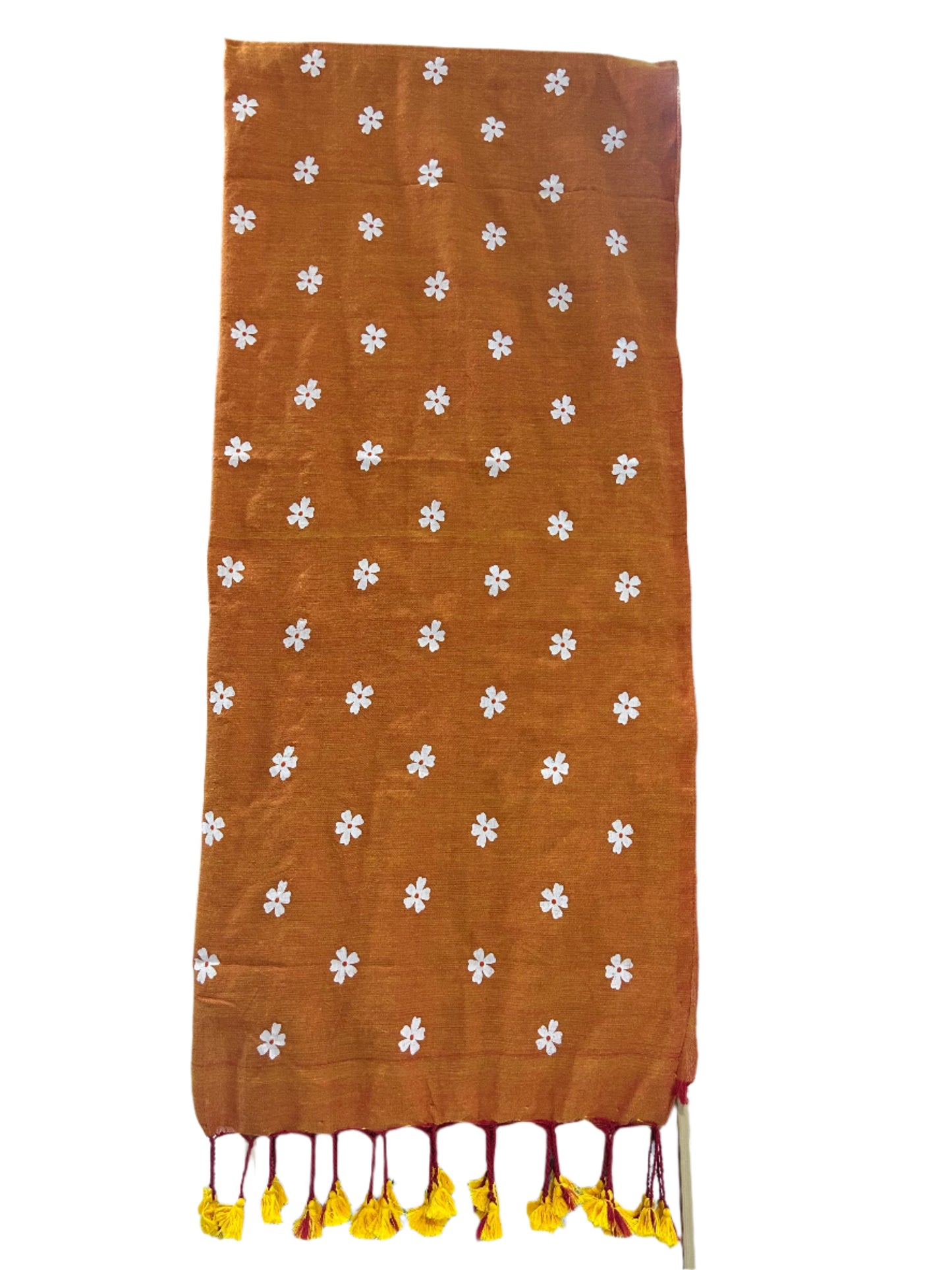 Brown fabric with white floral patterns on a table