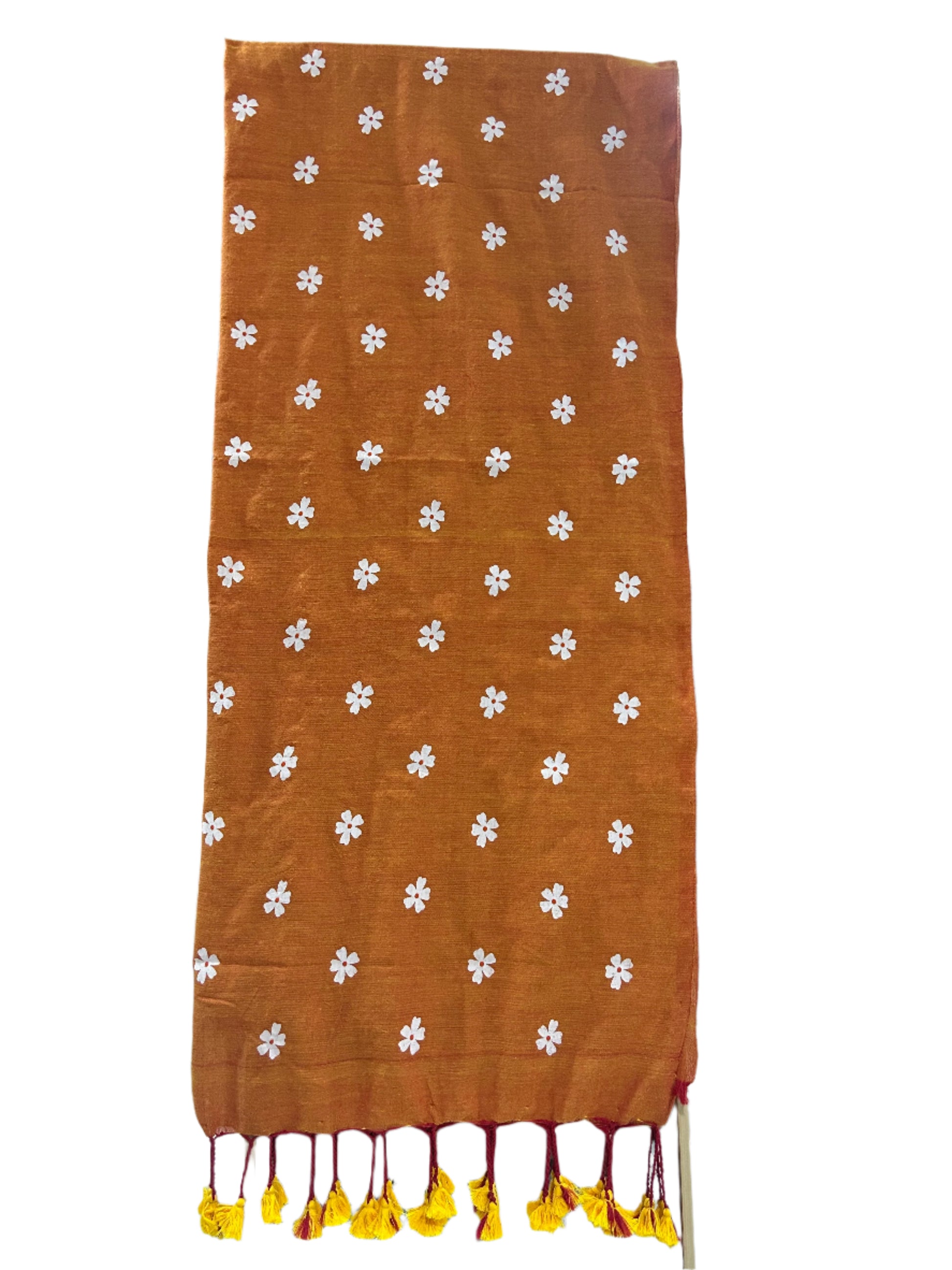 Brown fabric with white floral patterns on a table