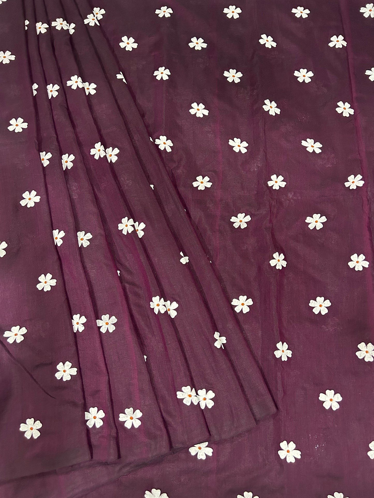 Purple fabric with white floral patterns