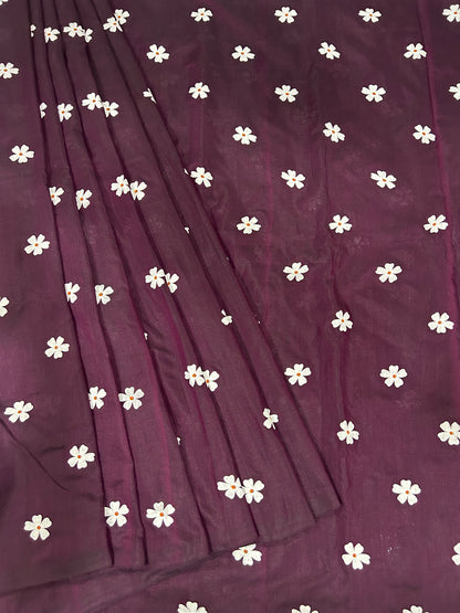 Purple fabric with white floral patterns